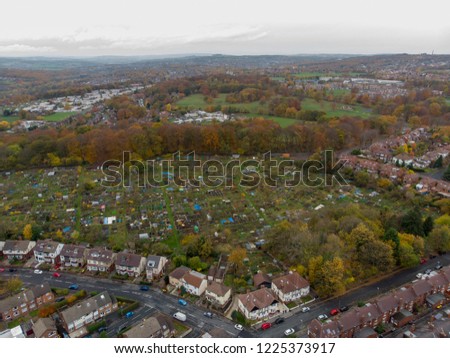 Aerial photo of a typical town in the UK showing rows of houses, paths & roads, taken over Headingley in Leeds, which is in West Yorkshire in the UK.