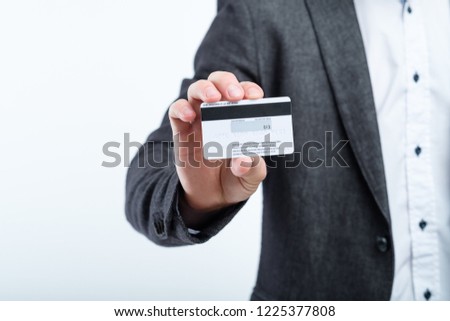credit card CVV2 code. online shopping safety. man holding plastic card.
