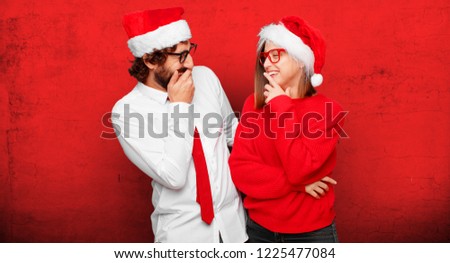 young couple expressing christmas concept. couple and background in different layers