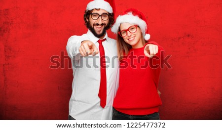 young couple expressing christmas concept. couple and background in different layers