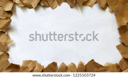 decorative frame of torn brown paper