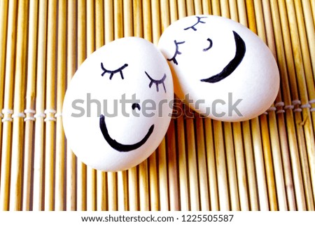White two eggs with smiley face.