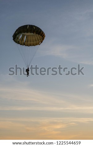 round parachute military model at sunset