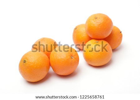 Group of tangarines isolated on White background Royalty-Free Stock Photo #1225658761