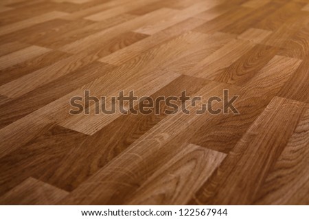 The floor of the light brown laminate diagonally Royalty-Free Stock Photo #122567944