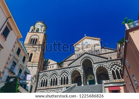 Stairs leading to the Amalfi Cathedral and bell tower under clear blue sky, in the historic centre of the town of Amalfi, on the Amalfi Coast, in southern Italy Royalty-Free Stock Photo #1225686826