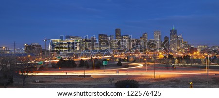 Denver Skyline. Panoramic image of Denver skyline and busy highway in the foreground.
