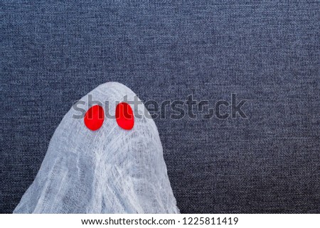 close-up Image of a ghost on a  dark background. Concept our fears and nightmares. Copyspace
