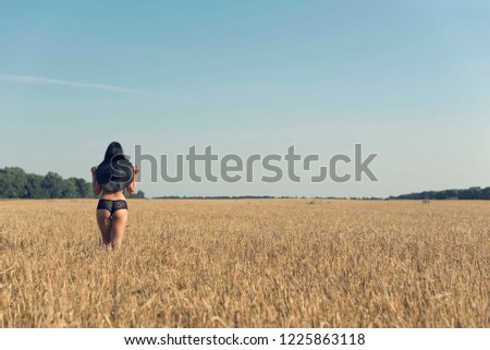 Summer walk in the countryside with a girl
