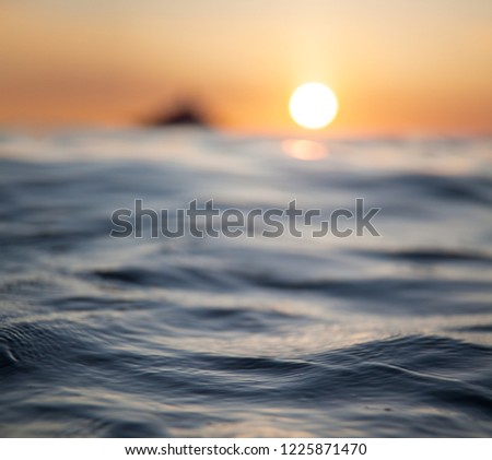 Sun glare on the sea surface, macro shot. Royalty-Free Stock Photo #1225871470