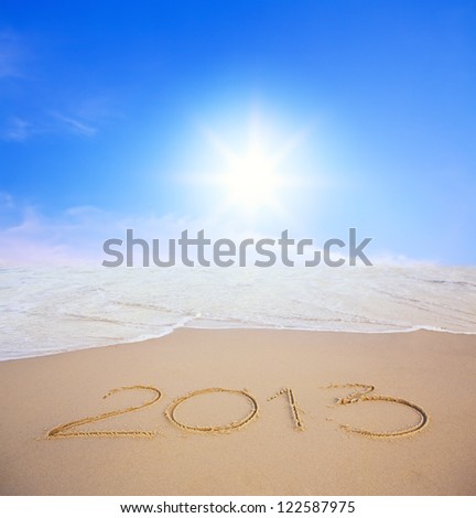 2013 year on the beach with blue sky and sun Royalty-Free Stock Photo #122587975