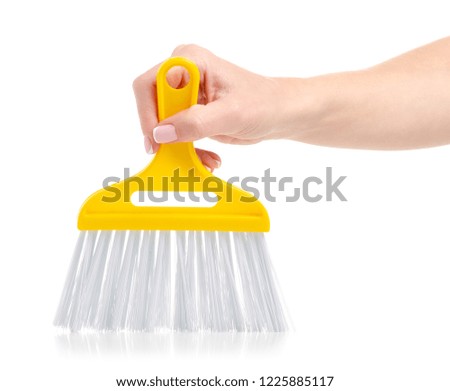 Broom in the hands on a white background. Isolation