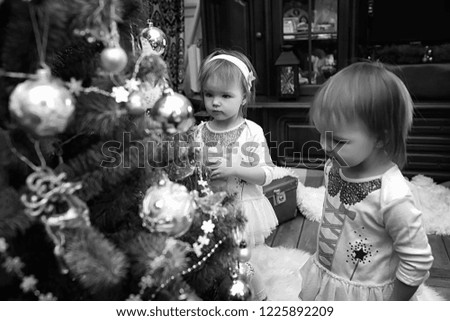A young family with twins girls in the New Year's holiday