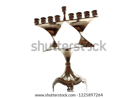 Menorah for Hanukkah in the form of a Jewish star (Magen David). Jewish Holiday. Symbol of Hanukkah and Judaism. Image for Jewish Holiday Hanukkah, Israel. Menorah isolated on white background