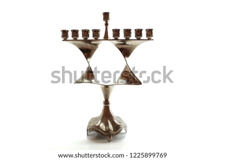 Menorah for Hanukkah in the form of a Jewish star (Magen David). Jewish Holiday. Symbol of Hanukkah, Judaism. Image for Jewish Holiday Hanukkah, Israel. Menorah isolated on white background