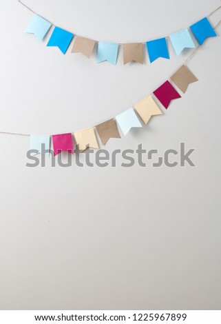 Pastel bunting paper cut on Pastel bunting paper cut on Bright gray wall backgroun