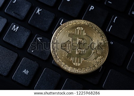 Close up of bitcoin on keyboard