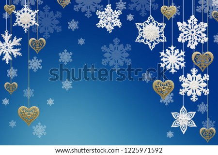 Christmas and New Year decorations: snowflakes and golden hearts on blue background.