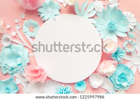 blue, pink and white paper flowers on the pink background