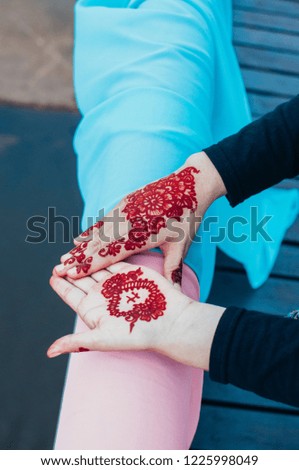 Brides with henna on hands