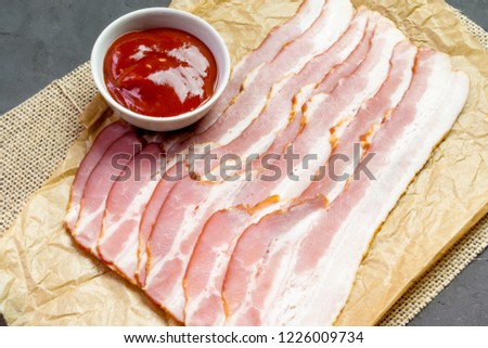 Slices of bacon and ketchup