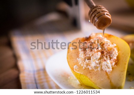 Backstage with a shot of pears with cottage cheese, nuts and cinnamon. The process of putting honey on pears. Preparing the frame for shooting. Creating a photo