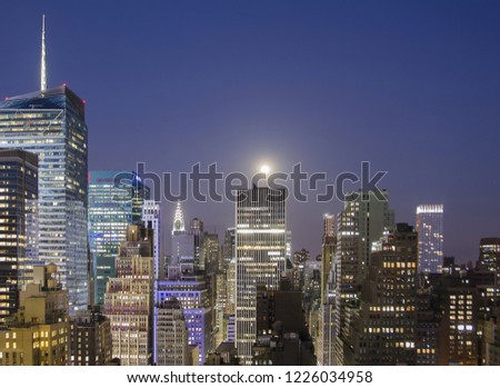 New York buildings at night illuminated by moonlight