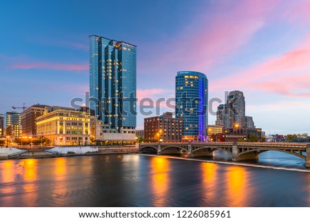 Grand Rapids, Michigan, USA downtown skyline on the Grand River at dusk. Royalty-Free Stock Photo #1226085961