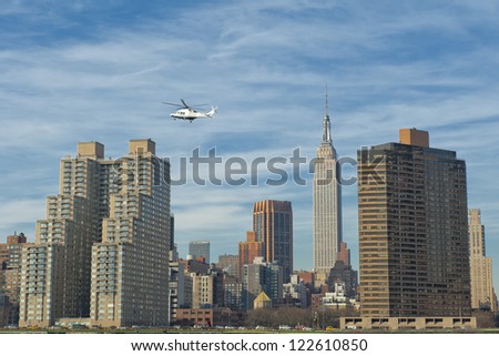 NEW YORK A view from river with Empire state building and Helicopter