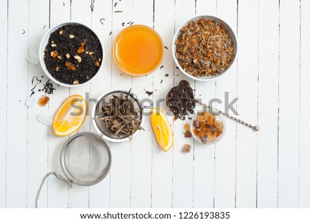 medical tea crops variation on white wooden table background