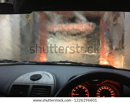Blur image taken inside car during automatic car wash