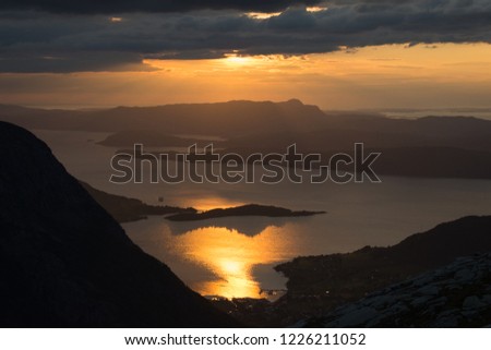 Kvinnheradsfjord in the golden sunset. Picture is taken from slope of mountain Andersfjellet.