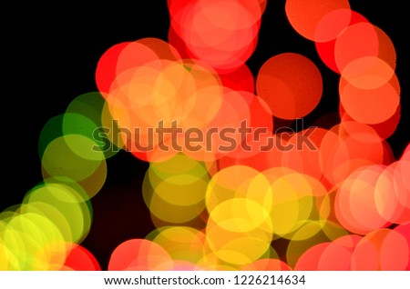 Colorful red, orange and green bokeh of decoration lights during Christmas and new year in a Christmas market