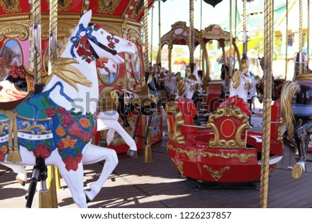 Carousel for children with horses attractions in the Park