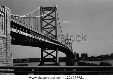 Black and White film shot of the bridge leading toward downtown Philadelphia 