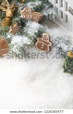 Merry christmas holiday decoration background with ginger man snowflakes snowman and tree cookies dry orange. Light wooden table. Space for text