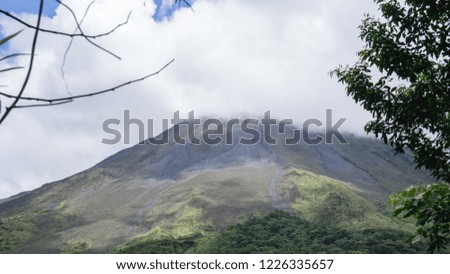 Beautiful view to the Arenal Volcano with lots of clouds