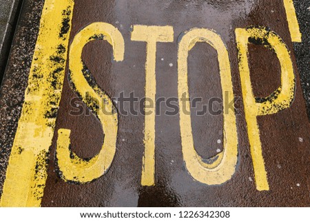 Vintage stop sign on city asphalt floor