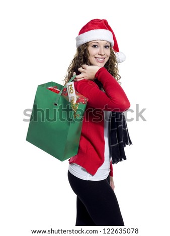 Side view portrait of a attractive young female holding shopping bag over white background,