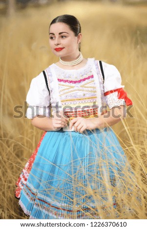 Young beautiful slovak woman in traditional costume 