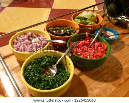 Making guacamole ingredients Royalty-Free Stock Photo #1226413063