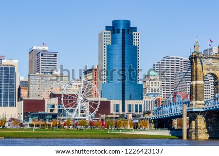 Cincinnati Ohio river front boat coal barges and city scape in November on a beautiful clear day looking from Covington Kentucky urban exploration photography