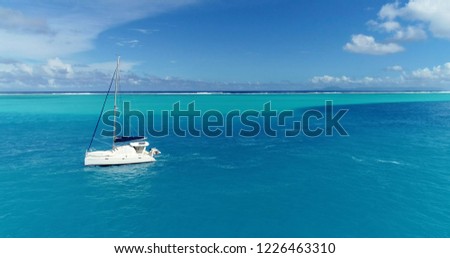catamaran in a lagoon in aerial view, French Polynesia