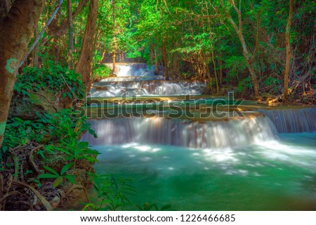 Landscape photo, beautiful waterfall in deep forest at Huai Mae Khamin, Thailand, Nature Blackground