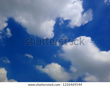 Blue sky and white clouds in the daytime. 