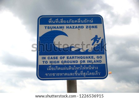 Tsunami warning sign at Patong beach, Phuket, Thailand.