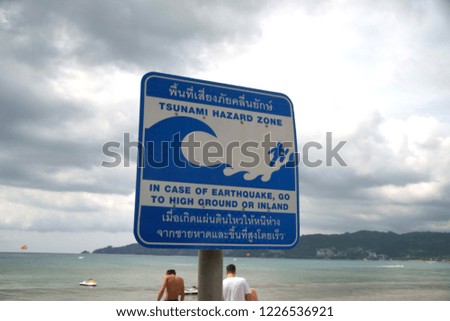 Tsunami warning sign at Patong beach, Phuket, Thailand.