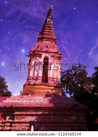 This is a inclined position pagoda in Wat Phra Luang temple, the national historic site, Phrae Thailand. This photo is retouched to a galaxy photo.