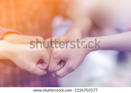 Close up top view close fists high five, fist bump    work group diversity people team collaborate working community to goal to successful of business in Unified Friendship Concept
 Royalty-Free Stock Photo #1226703577