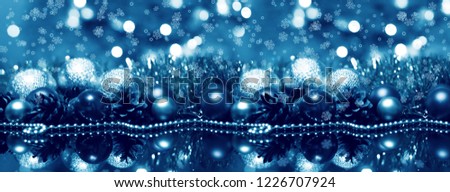 Festive Christmas background with Christmas balls, bokeh, glow
